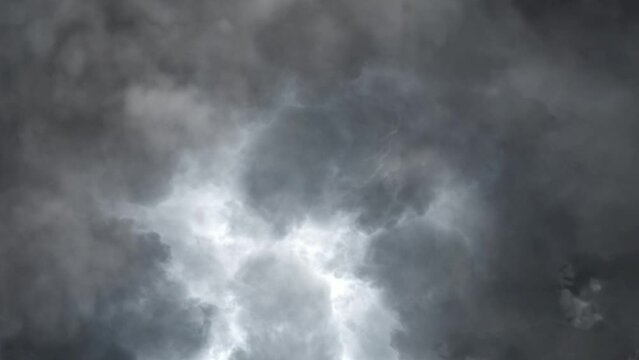 The view enters a cloudy gray cloud filled with lightning strikes