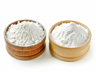 Baking Powder and Baking Soda Containers of baking powder and soda, shown side by side for their leavening properties in baked goods, isolated on white blackground.