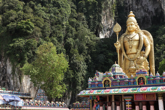 The tall golden Hindu statue of Murugan in the Batu Caves near Kuala Lumpur, Malaysia