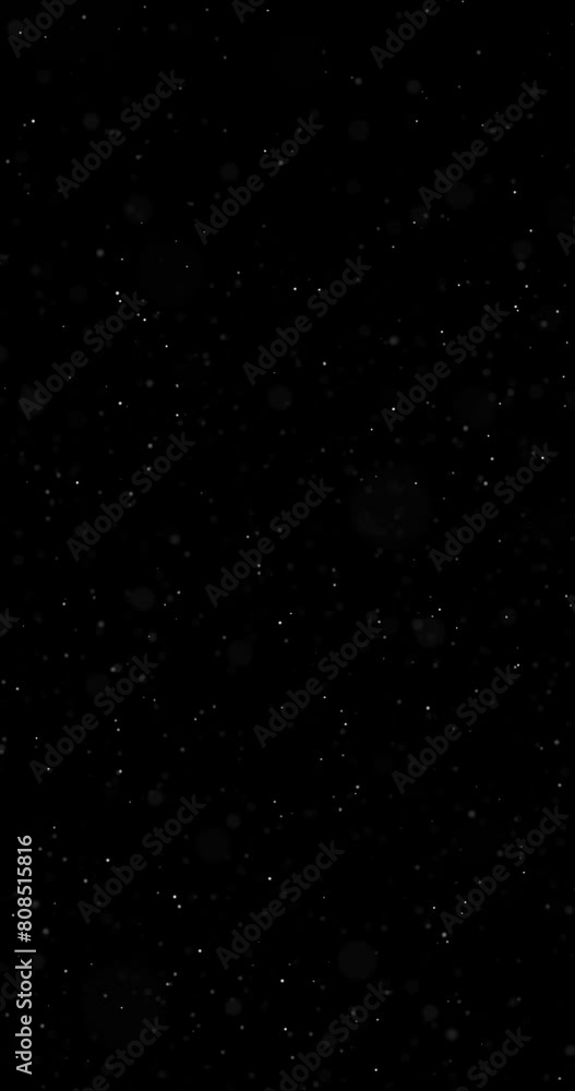 Poster loop blurred dots vertical movement slow motion on black background.