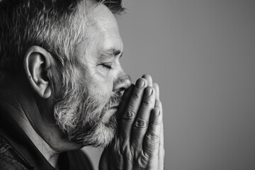 a man with a beard and a bearding is praying