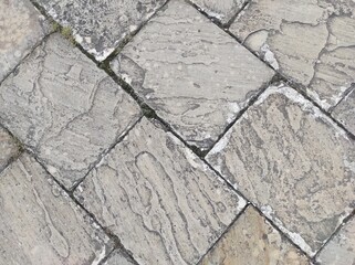 Cobblestone texture. Gray paving stones outside close-up. Design blank