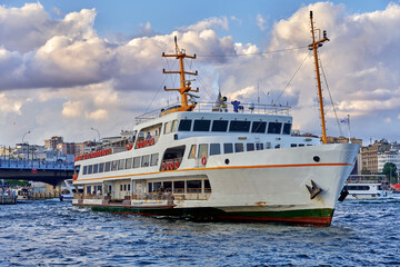 Istanbul, Turkey - September 6, 2022: Ferry boat sailing in Bosphorus Strait, with Istanbul skyline...