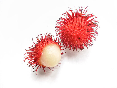 Rambutan on white background. Peeled rambutan on white background. Ripe rambutan sweet tropical fruit.