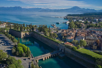 Top view of the town of Peschiera del Garda, the main gate of Porta Brescia located on the shores...