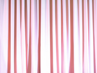 The pink curtains are beautifully wavy.