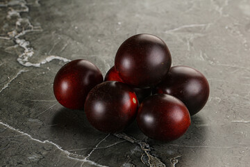 Raw ripe black kumato tomato