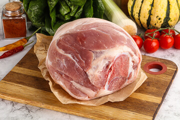 Uncooked raw pork knuckle with spices - obrazy, fototapety, plakaty