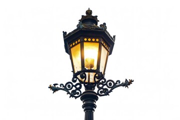 A close-up of an ornate vintage street lamp glowing warmly against a clear sky, capturing a nostalgic and charming urban atmosphere.