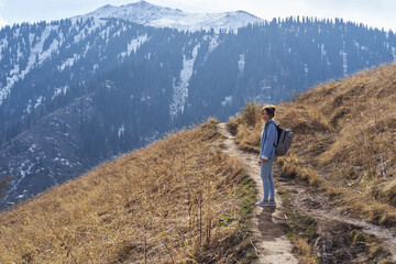 Woman walk along a path uphill