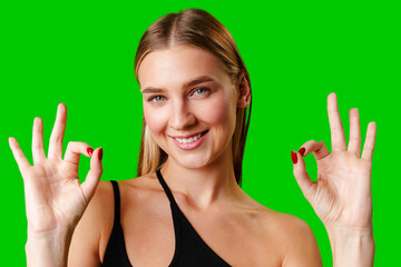Young Woman Giving Thumbs Up Sign on Green Screen