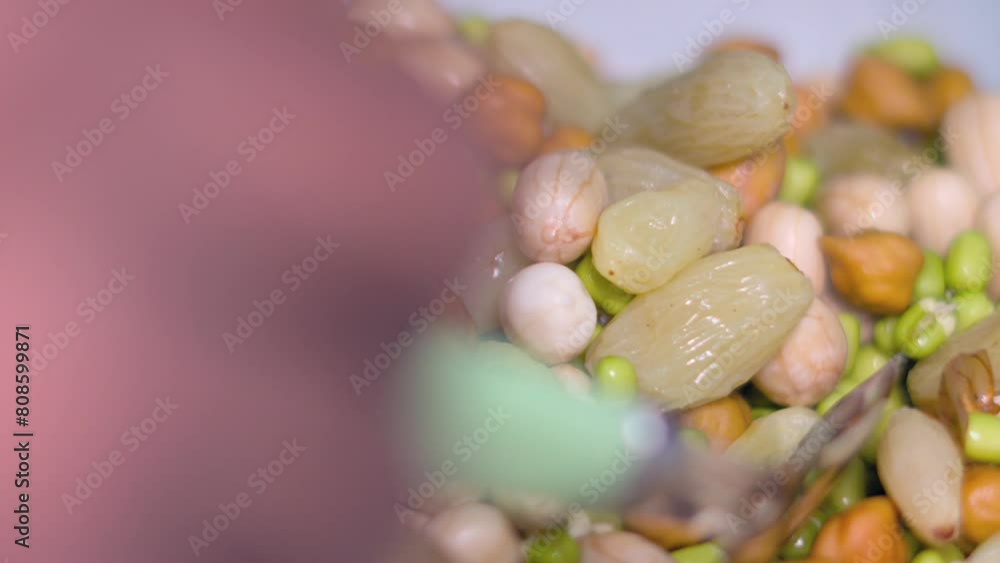 Poster taking soak sprouts and nuts from tifinbox closeup view