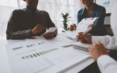 Business team presentation meeting Asian Men Finance Executive discusses meetings to plan work,...