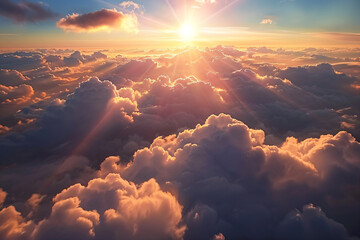 a view of the sun shining over the clouds