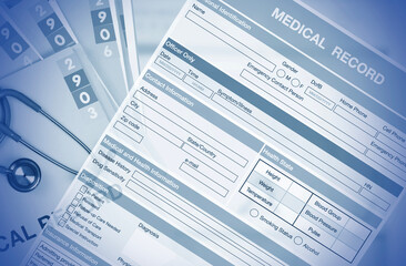 Monotone color photo of medical record sheet for background.