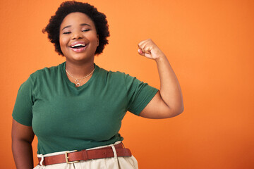 Smile, flex and portrait of black woman in studio for empowerment, motivation and feminism. Happy,...