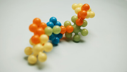 3d molecule, medicine and research in studio for chemistry, education and learning on white background. Plastic model, chemical element and particle for experiment on bacteria, atom and science