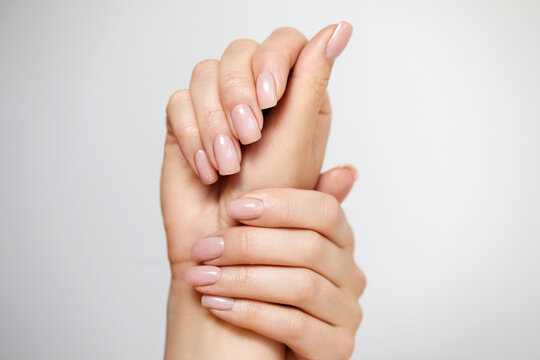 Beautiful Woman hand closeup. Manicure and Hands Spa. Manicured nails and Soft hands skin. Cosmetology, beauty. Skin care