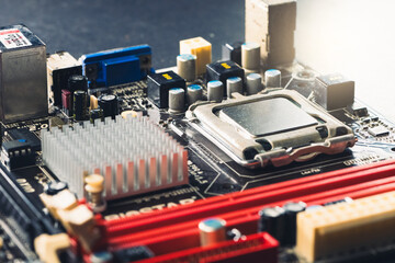 The technician is putting the CPU on the socket of the computer motherboard.