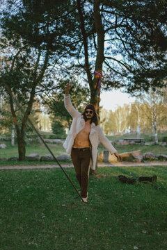 Young man balancing on slackline