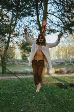 Young man balancing on slackline
