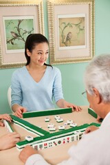Fototapeta premium The family playing mahjong