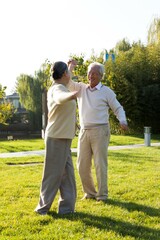 Elderly couples dance in the courtyard