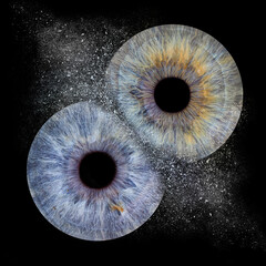 Two human irises on black background. Blue and yellow pupils close up. Explosion of eyes 