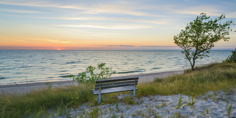Beach view panorama, sunset, calm sea, wooden bench on dune near the sea, ocean.