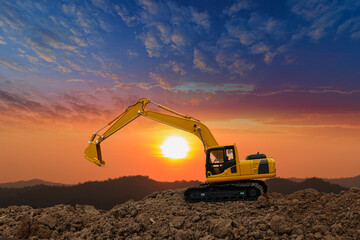 Crawler excavator with are digging the soil in the construction site on the sunset  backgrounds