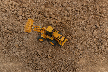 Wheel loader  are digging soil with  in the construction site ,Top view