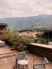 Sunset on Outdoor patio with view of Fujian Tulou at the background, Fujian China