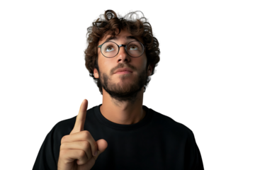 European man in total black wearing eyeglasses, pointing upwards with finger on isolated transparent background