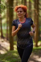 Woman trail runner in the forest - 808651261