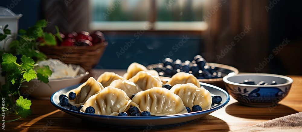 Poster table with a plate of delicious dumplings and a side of blueberries with plenty of space around for 