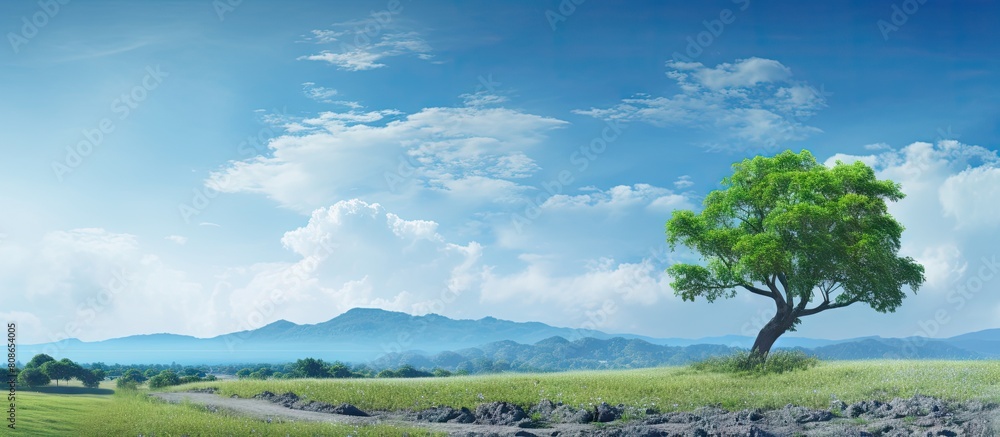 Poster a scenic view of a landscape with a blue sky serving as the background. copy space image. place for 