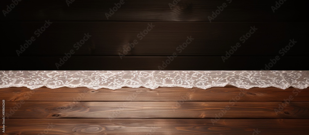 Poster view of a wooden table with white lace providing a clear space for text in the image. copy space ima