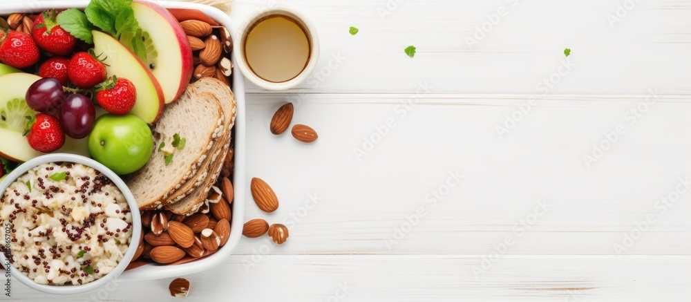 Poster top down view of a lunch box dinner filled with a nutritious assortment of oatmeal cucumber salad nu
