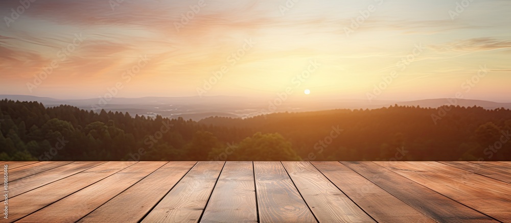 Poster a wooden table is seen against the backdrop of a blurred sunrise creating a captivating copy space i