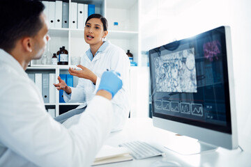 Computer, discussion and team of scientists in laboratory studying microorganisms, dna or particles. Science, technology and pharmaceutical researchers work on medical experiment for rna on desktop.