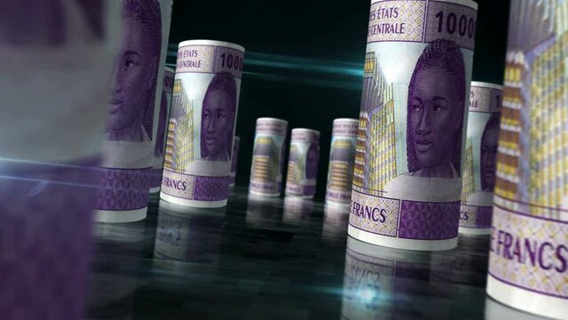 Central African CFA Franc money Cameroon Chad Congo Gabon money rolls loop 3d on table. Seamless loopable abstract concept of economy, finance and business. Camera between 10000 XAF rolled banknotes.