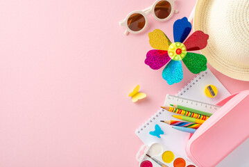 Vibrant children's summer educational tools including a colorful pinwheel, school supplies, and a...