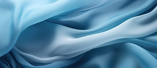 Close up image of a soft chiffon fabric with an abstract blue texture. Copy space image. Place for...