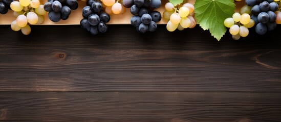 A wooden background showcases black and white grapes with apricots in a delightful top down perspective with room for text. Copy space image. Place for adding text and design - Powered by Adobe