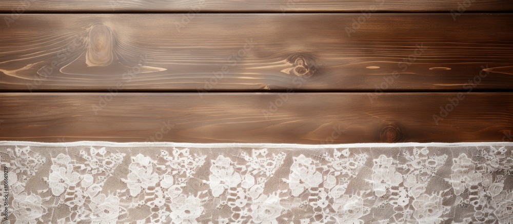 Poster top down view of a wooden table adorned with elegant white lace ample space available for adding tex