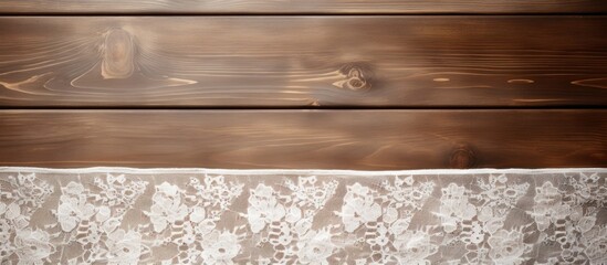 Fototapeta premium Top down view of a wooden table adorned with elegant white lace Ample space available for adding text into the image
