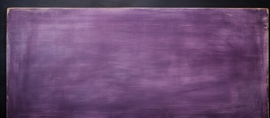 Fototapeta premium Copy space image of a purple blackboard with a blank chalkboard texture