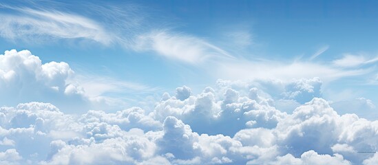 Copy space image featuring a mesmerizing abstract background of a blue sky adorned with fluffy...