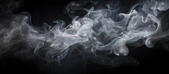 Copy space image of smoke cloud against a black backdrop