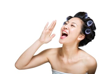 Shed young woman wearing a curling iron